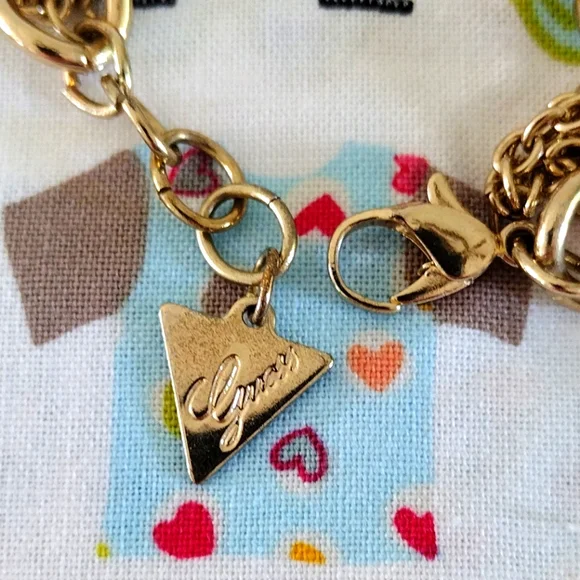 Guess Gold-Tone Romantic Charm Bracelet - Picture 8 of 10